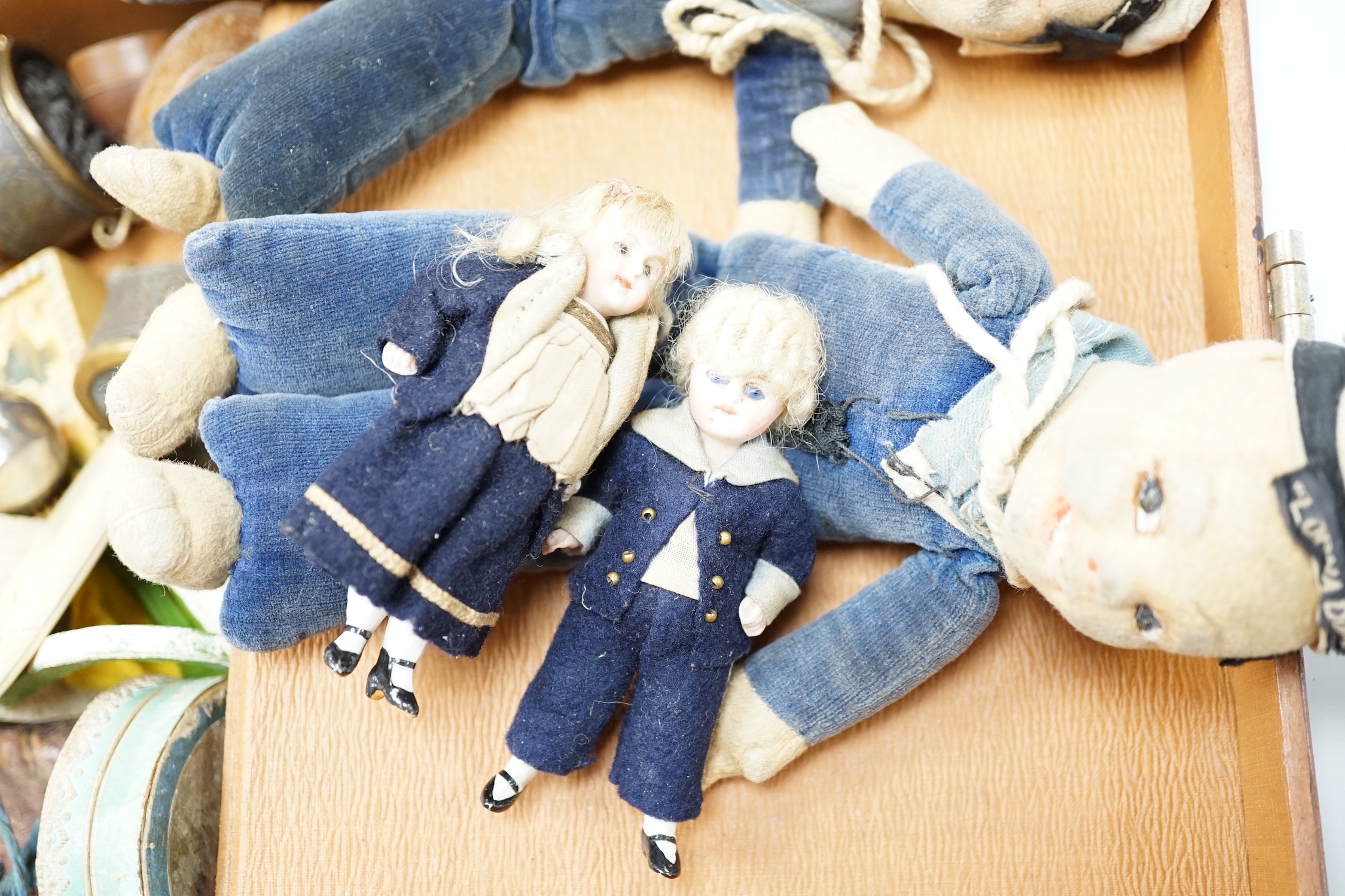 Two miniature bisque headed dolls, two sailor boy dolls and a collection related collectables,(a quantity)